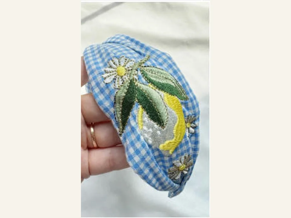 Blue gingham embroidered padded headband development sample