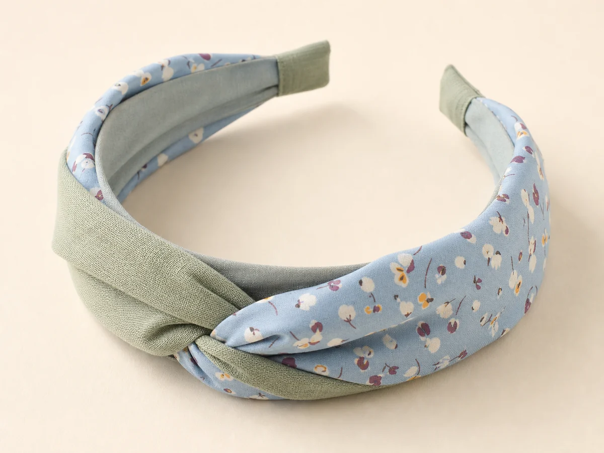 Sage cotton-linen and powder blue floral fabric headband with a low center twist