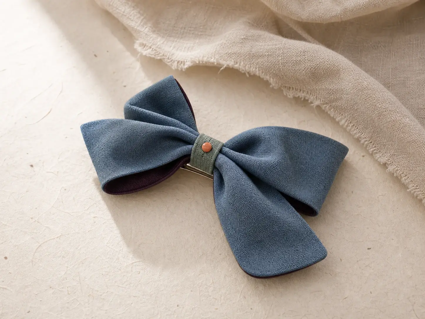 concept asymmetric cool blue textile bow barrette with plum underside