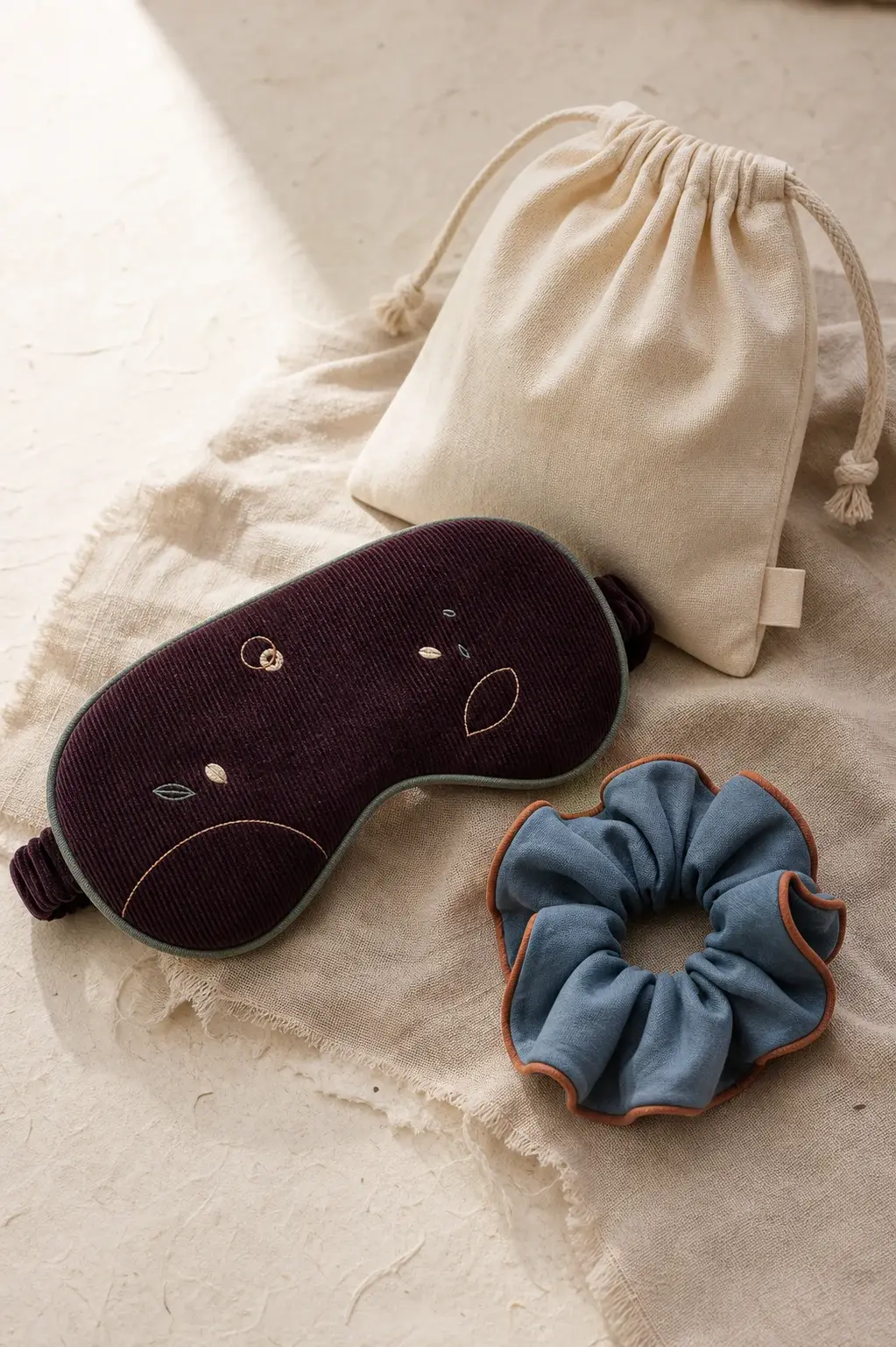 Concept coordinated textile gift set with sleep mask scrunchie and pouch